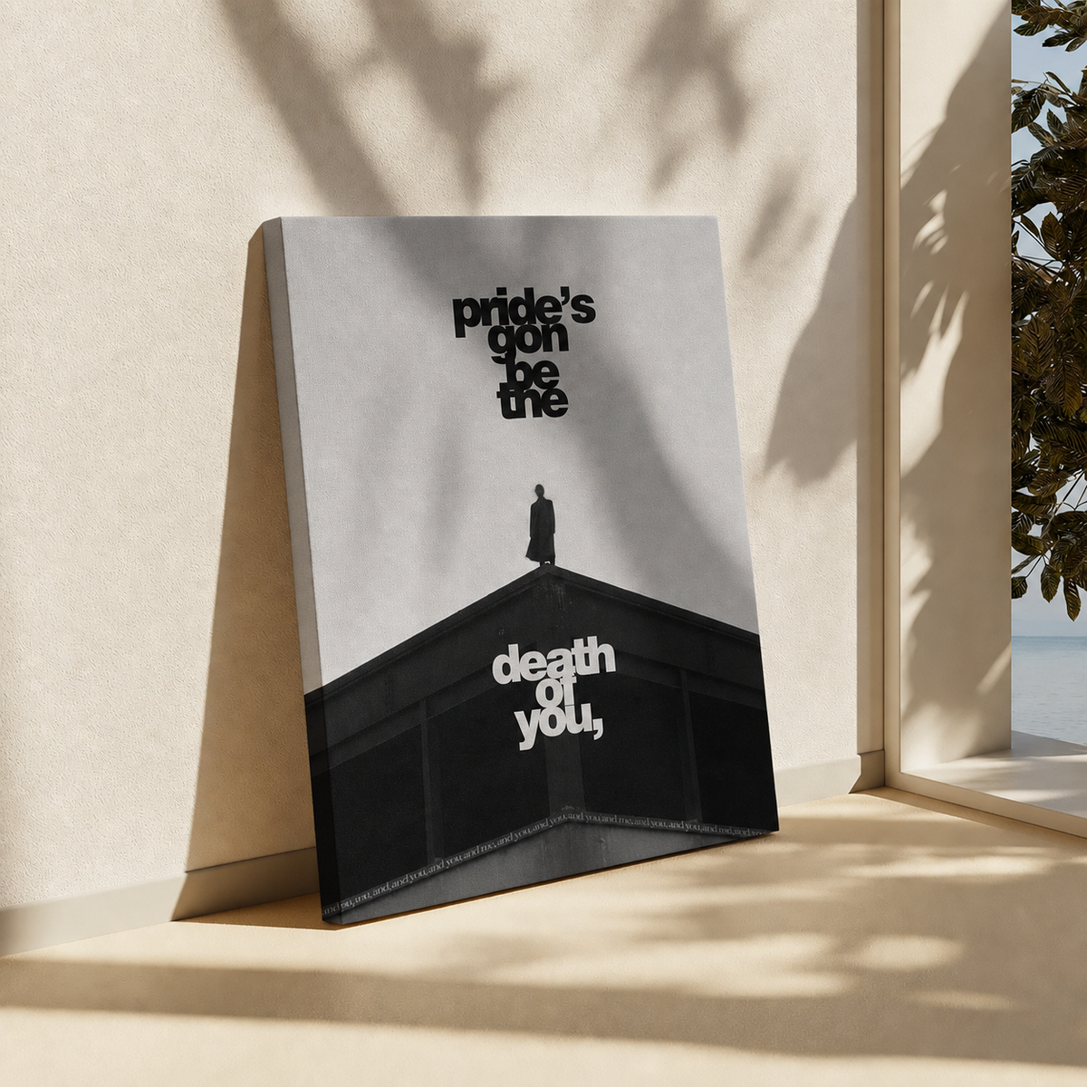 A square art print or poster leaning against a beige wall on a windowsill, with sunlight and leaf shadows cast across it. The print shows a black-and-white architectural scene with the text 'pride's gonna be me' in black and 'death of you,' in white.