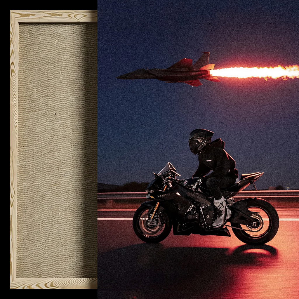 A framed art print or canvas featuring a motorcycle rider on a highway at night with a fighter jet flying overhead and a bright exhaust trail, shown next to a close-up of the textured beige fabric or paper material.