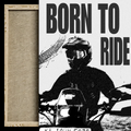 A framed wall art print featuring a black-and-white graphic of a motorcyclist with the large text 'BORN TO RIDE.' A narrow wood frame and textured mat are visible on the left side, shown against a plain white background.