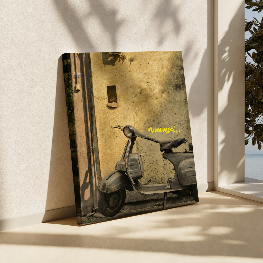 A rectangular wall art print or canvas leaning against a light beige wall on a windowsill, showing a vintage scooter parked against a textured yellow wall. The artwork has a warm sepia-toned palette with a small yellow script text reading 'always'.