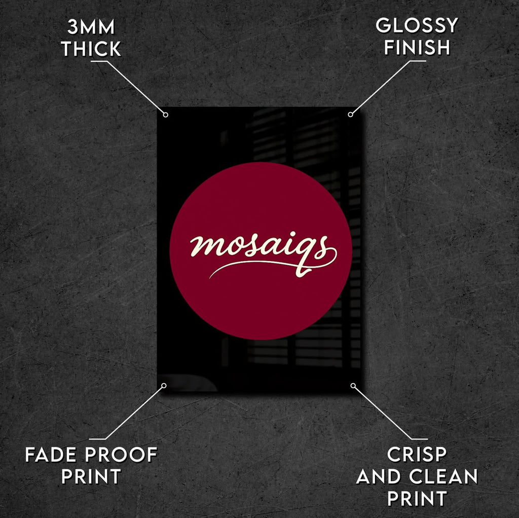 A black rectangular mosaic tile sample with a large dark red circular design and white script text reading 'mosaigs' in the center, shown on a dark textured background with callout lines and text describing features: 3mm thick, glossy finish, fade proof print, crisp and clean print.