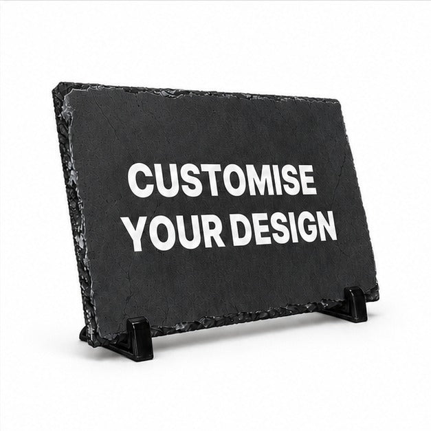 A black slate sign on a small black stand with the words 'CUSTOMISE YOUR DESIGN' in white capital letters, shown on a clean white background.