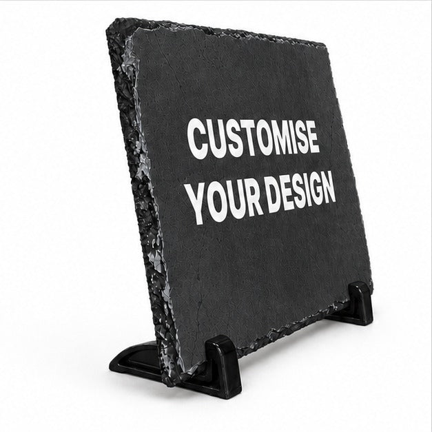 A black slate sign on a small black stand with the words 'CUSTOMISE YOUR DESIGN' in white capital letters, shown on a plain white background.