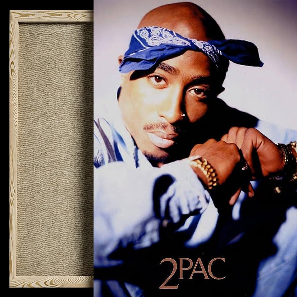 A framed art print featuring a portrait of 2 Pac with a blue bandana and light blue shirt, shown next to a textured beige mat board with a light wood frame.