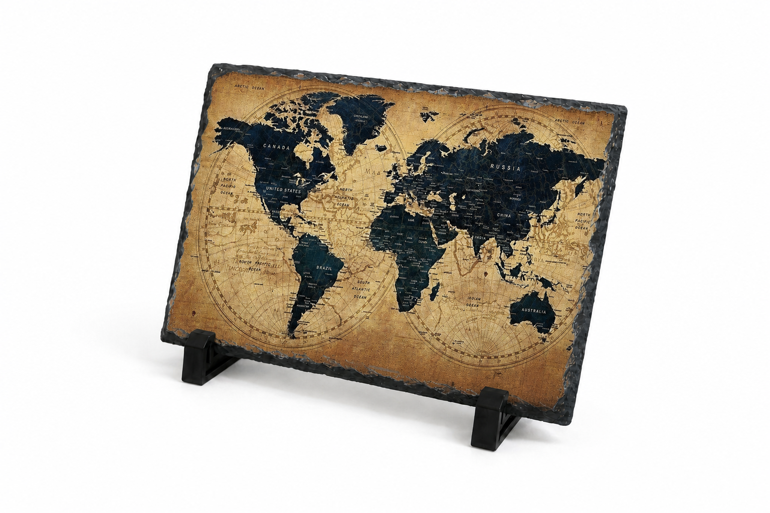 A rectangular world map plaque with an aged tan background and dark navy landmasses, displayed on a small black stand against a white studio background.