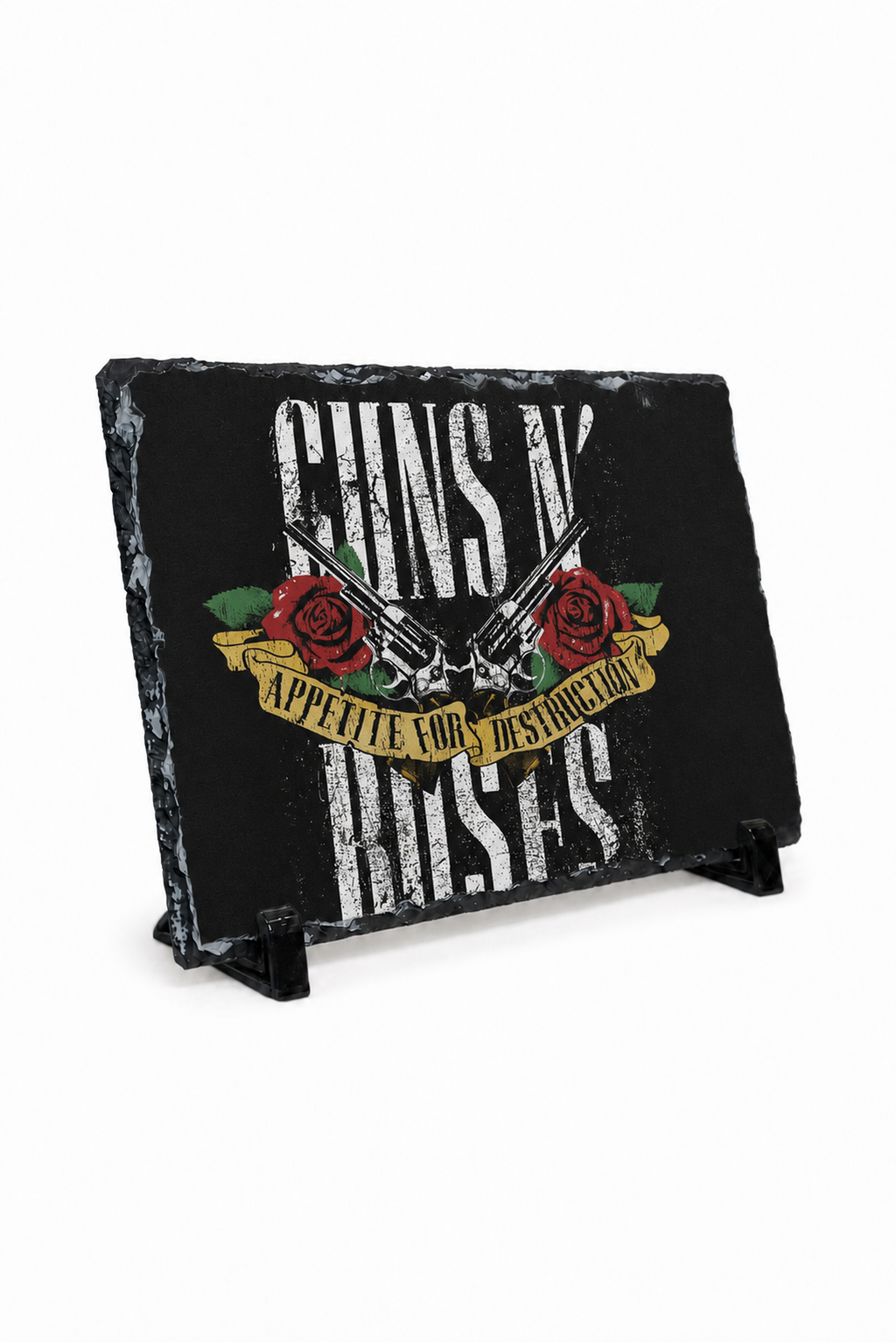 A rectangular black slate sign featuring Guns N' Roses artwork with distressed white text, red roses, and a gold banner, displayed on a small black stand against a white background.