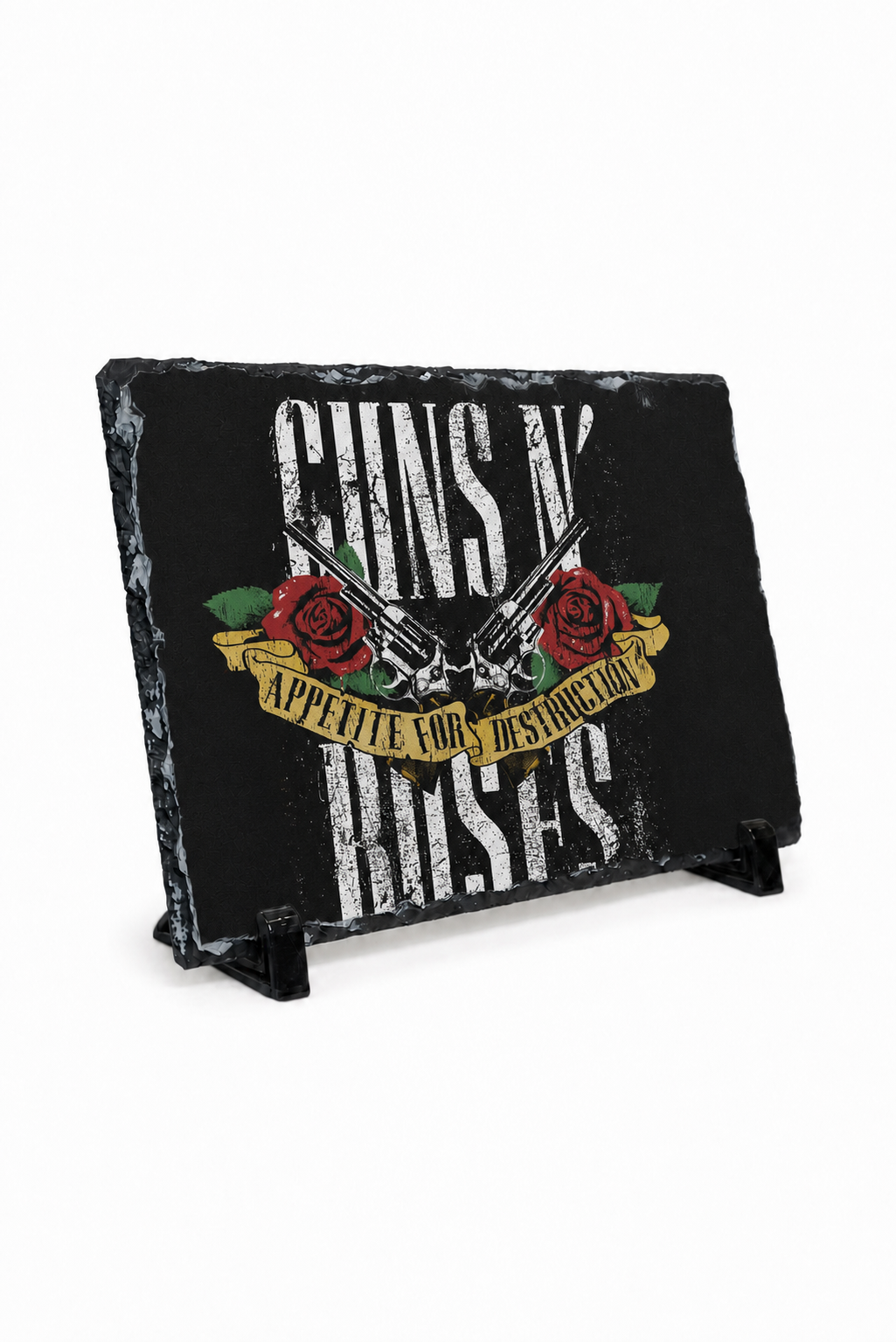 A rectangular black slate sign featuring Guns N' Roses artwork with distressed white text, red roses, and a gold banner, displayed on a small black stand against a white background.
