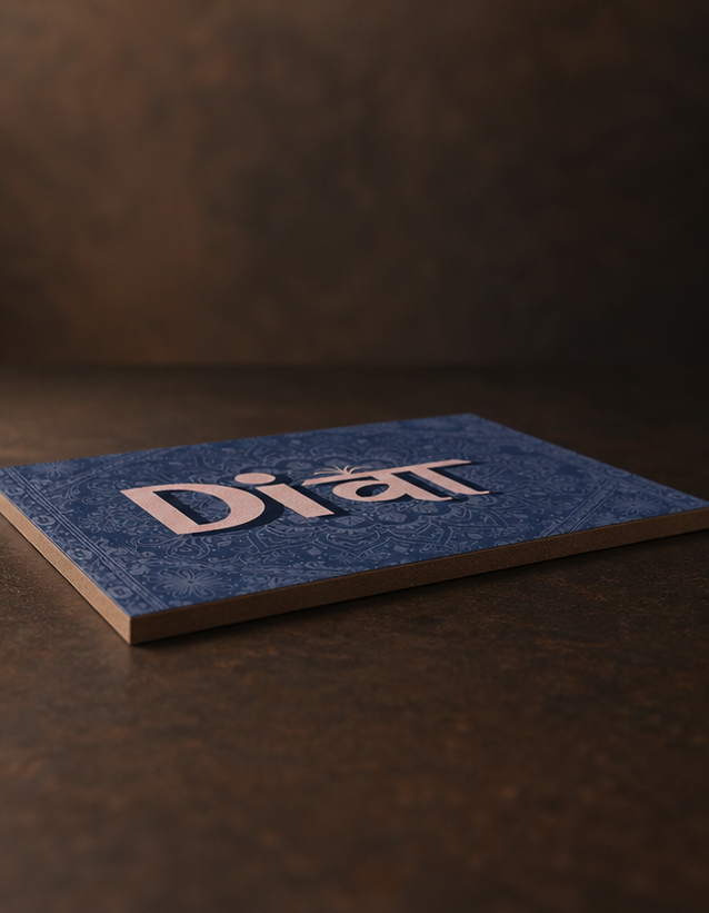 A square blue Diet tile coaster with a subtle damask pattern and raised white 'Diet' logo, resting on a dark brown textured surface.